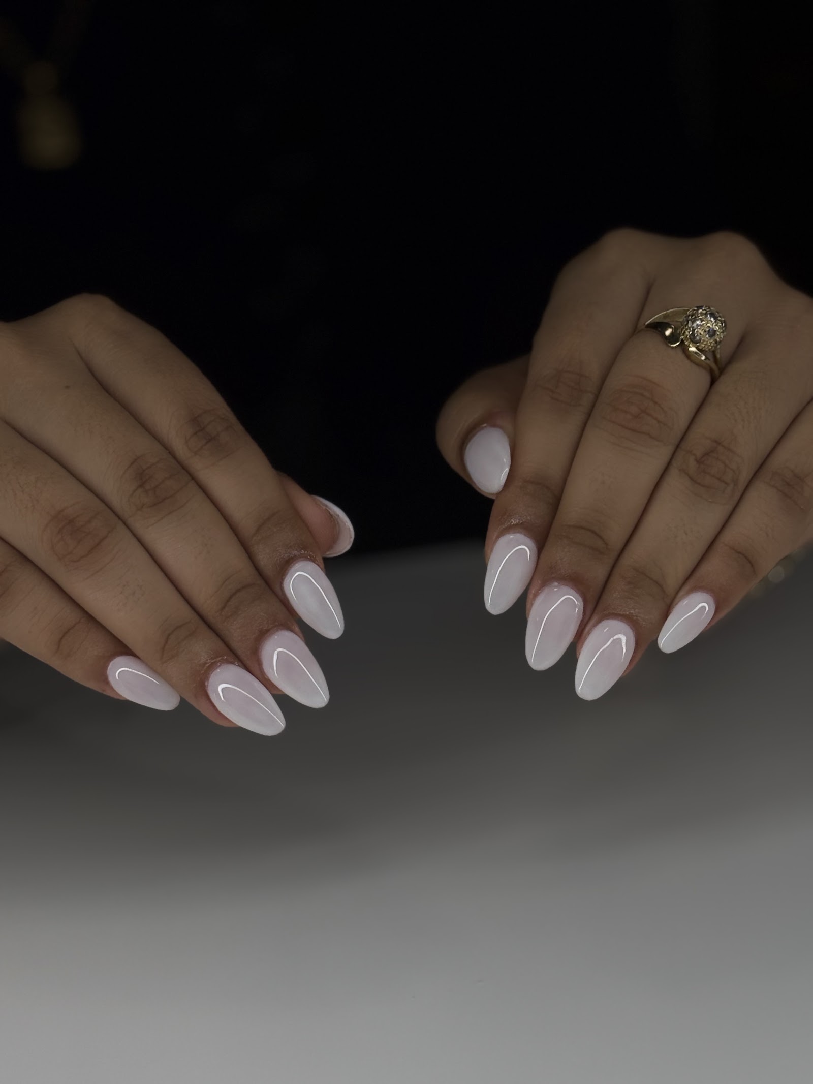 Soft white almond nails done at Yancy Nail Room
